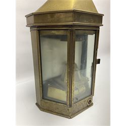 Large brass maritime lamp by Griffiths & Sons Birmingham with swing handle, threaded mounting bracket and associated oil burner, H41cm excluding handle