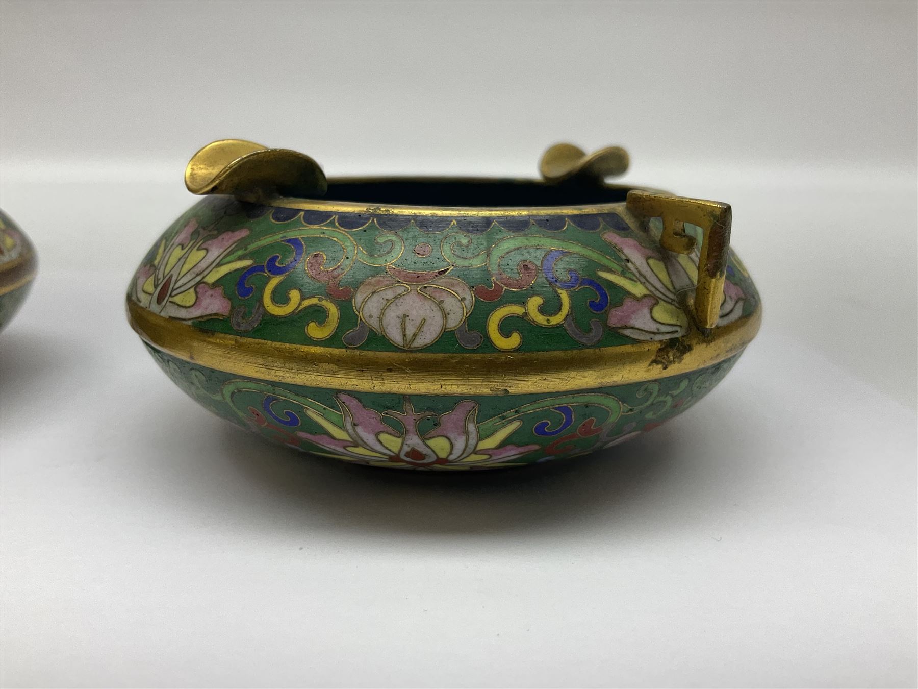 20th century Chinese cloisonne enamel smoking set, comprising two ashtrays, box and tray, with floral and foliate scrolling on green ground