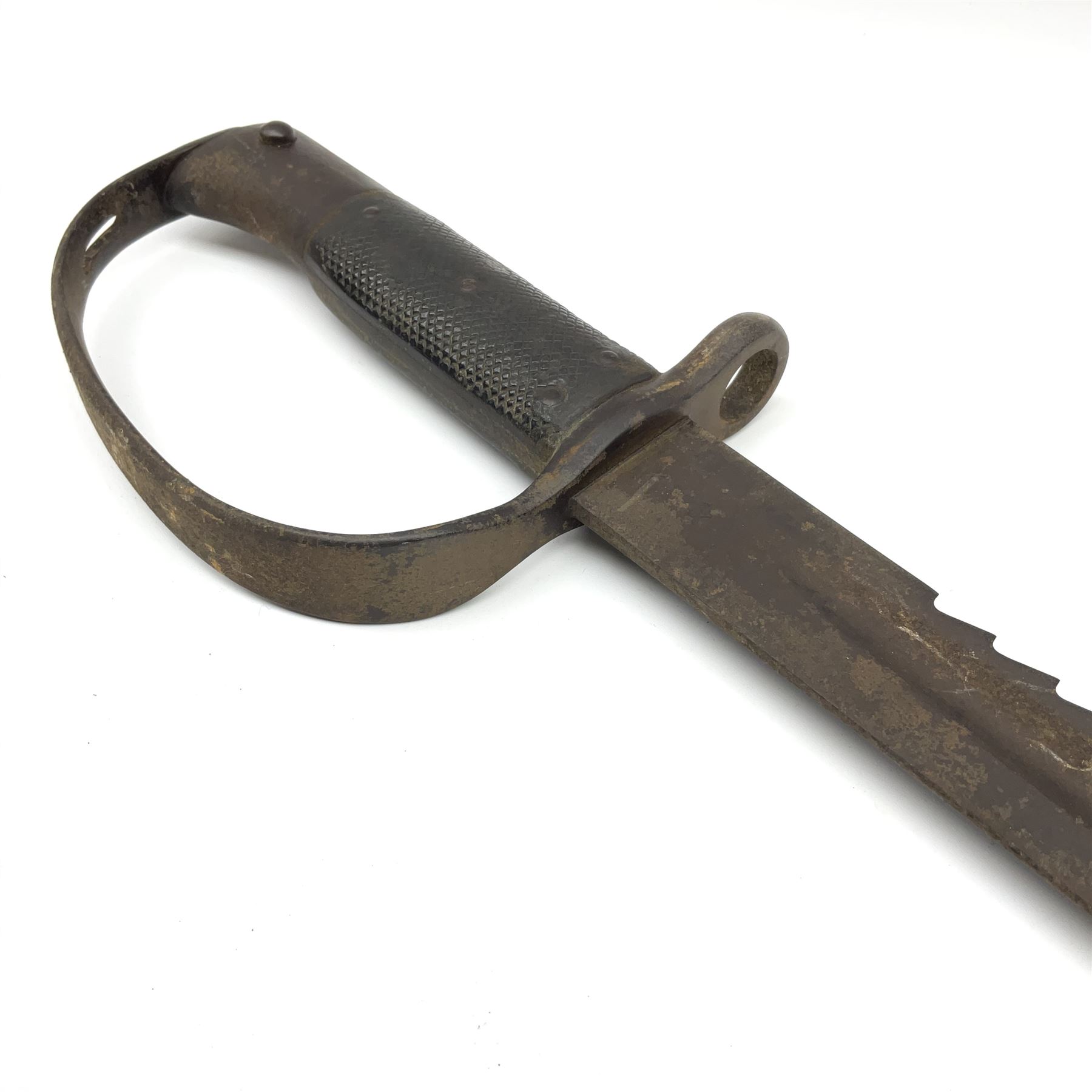 Pattern 1879 Martini Henry Carbine heavy artillery saw-back sword bayonet the 65.5cm fullered blade with various ordnance marks to the ricasso, black chequered grips and D-shaped knuckle guard, lacks scabbard, L79.5cm overall