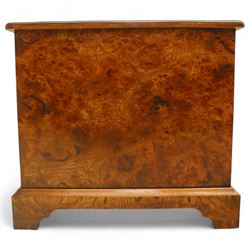 Late 20th century figured walnut miniature chest, the rectangular top with feather banded border over two short and two long drawers, fitted with brass batwing handles, upon moulded plinth base and four bracket feet, H60cm, w67cm, D36cm