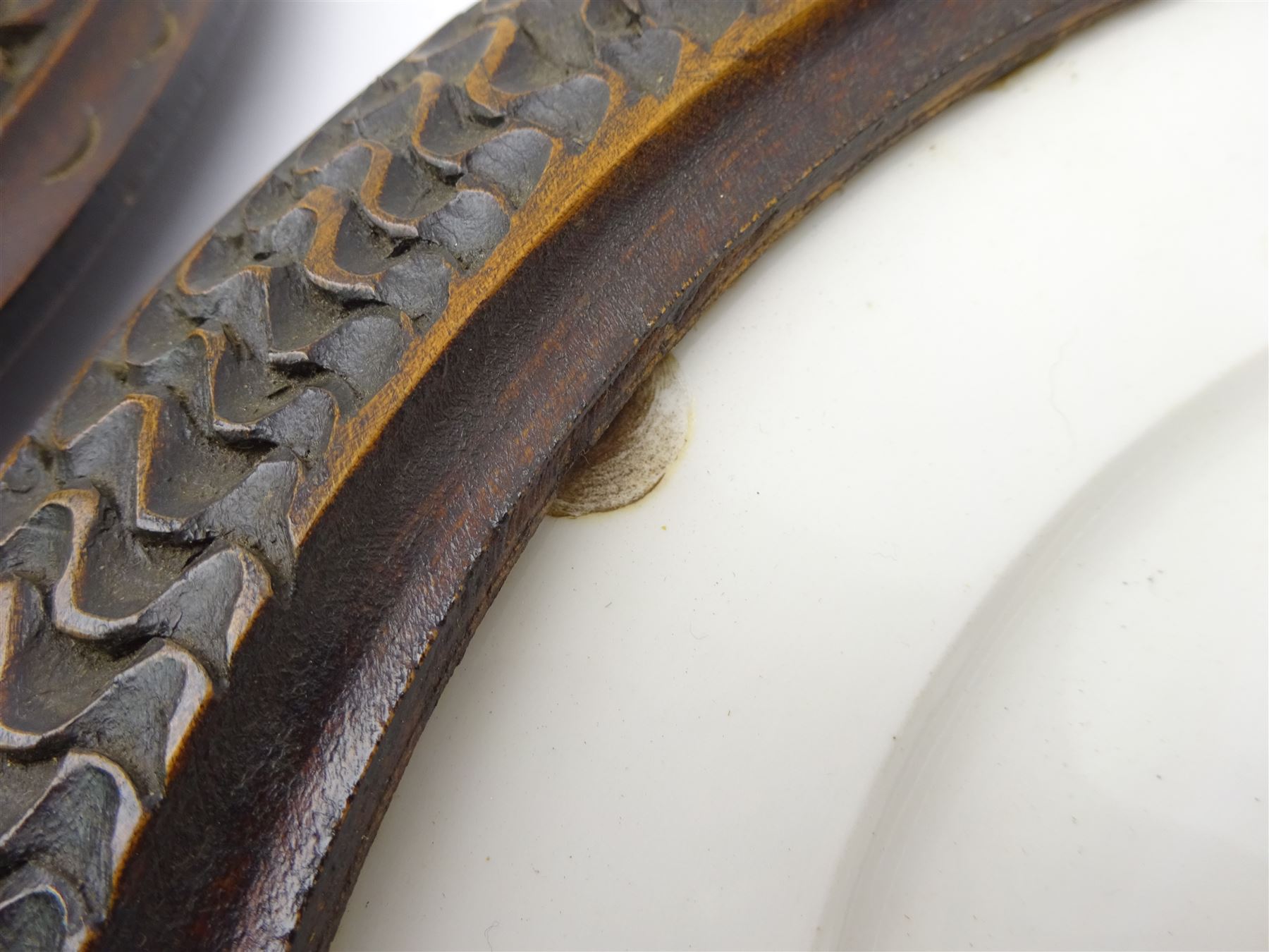 Pair mid 19th century Sevres porcelain plates, with gilt Louis Phillippe crowned monogram to centre upon a white glazed ground, with blue crowned LP mark, iron red destination mark for Chateau D'Eu, and chrome green cancelled potting mark S67 beneath, in carved oak mounts, overall D34cm
     