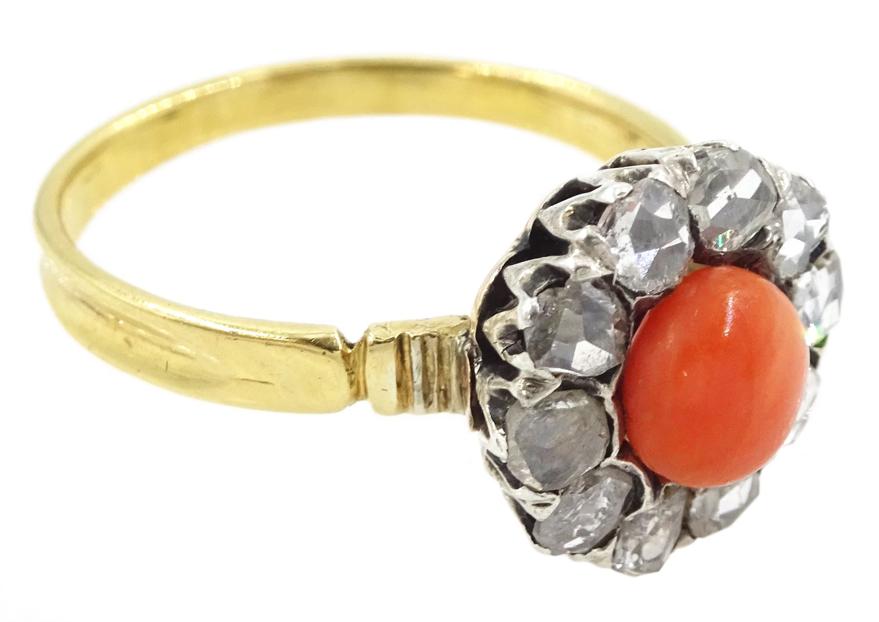 Early 20th century 18ct gold and silver coral and diamond cluster ring, single  cabochon cut coral, surrounded by ten rose cut diamond stones 