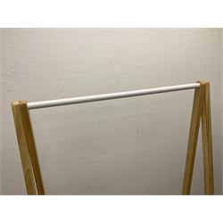 Modern clothes rail, wall mounted coat hook and two toilet roll holders