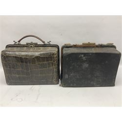 Early 20th century crocodile skin doctors bag, together with another similar doctors bag with fitted interior housing various silver-plate mounted glass bottles and bone tools, largest W35cm