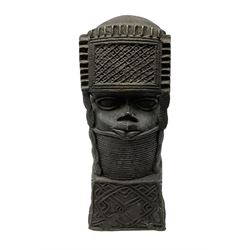 20th century Benin bronze head of an Oba, donning headdress and neck rings with wide open eyes, raised upon a tapering square base, the sides with relief cast knot decoration, H39cm
