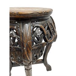 Pair of Chinese hardwood jardinière or urn stands, circular top with marble inset, the frieze carved and pierced with scrolling foliate decoration, raised on cabriole supports united by X-stretcher 