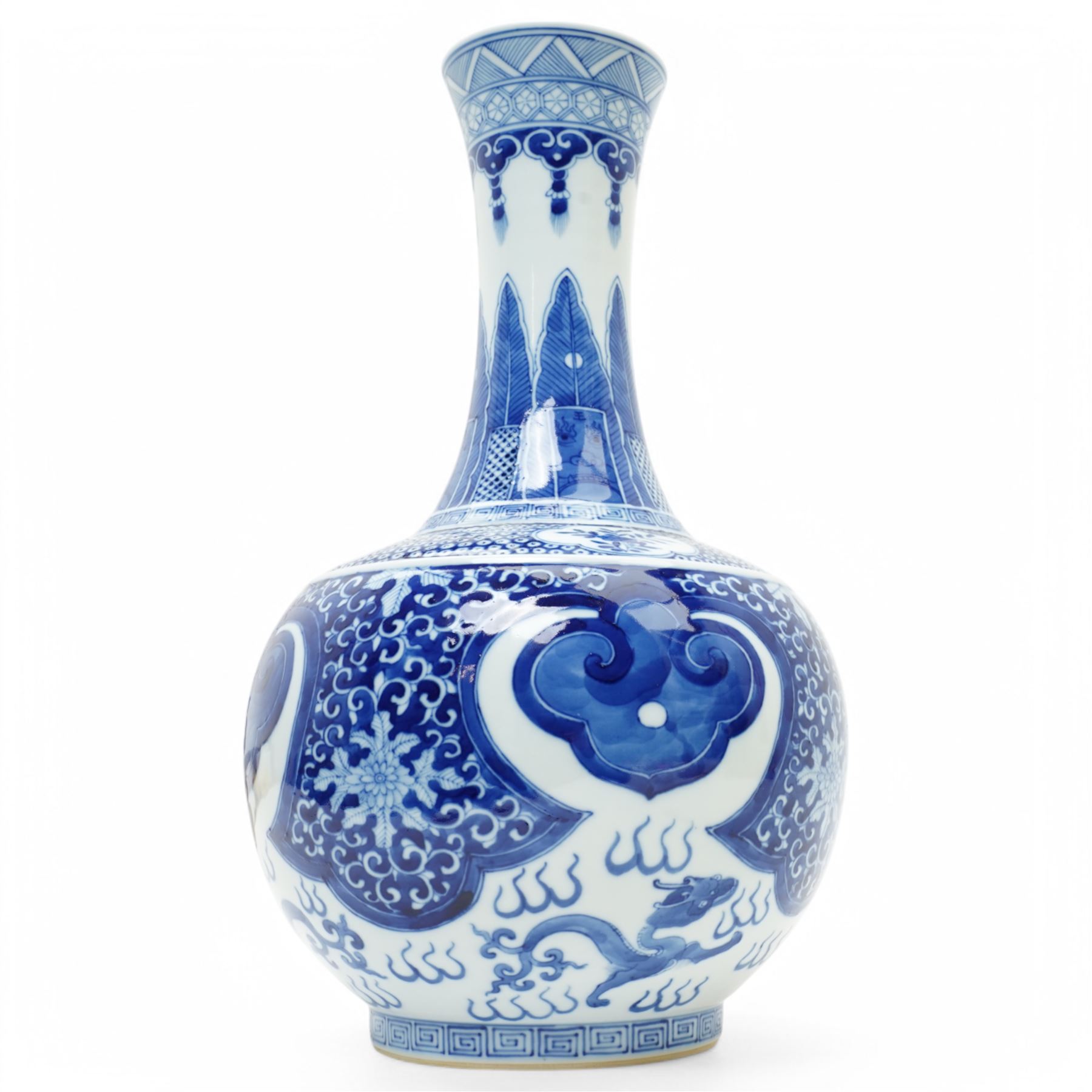 Late Qing Dynasty bottle vase decorated in blue and white with dragons and pearls, stylised leaves and flowers with key pattern foot H40cm 
