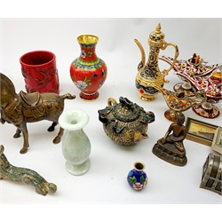  An Oriental bronze model of a Tang style horse, together with a small bronze modelled as a seated Tibetan buddha, a metal model of a Chinese dragon, two green soapstone carvings, a selection of modern cloisonne vases, etc.   