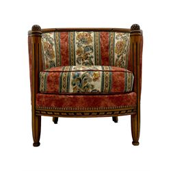 Pair of cherry wood framed tub-shaped armchairs, upholstered in striped floral fabric with brass stud trim, carved walnut frame with fluted supports capped with pinecone finials, on turned feet