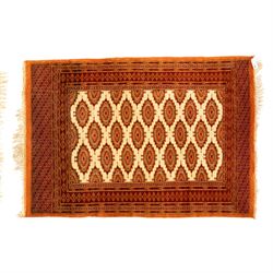 Three rugs,  comprising a Baluch rug in crimson ground, 179x97cm, a Tekke Bokhara rug in crimson ground, 201x132cm, and a Bokhara rug in ochre ground, 125x175cm 