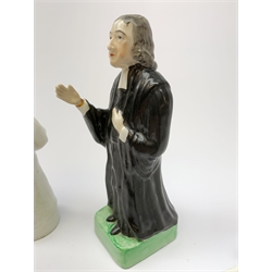 Three 19th century Staffordshire pottery figures, each modelled as John Wesley, largest H20.5cm.