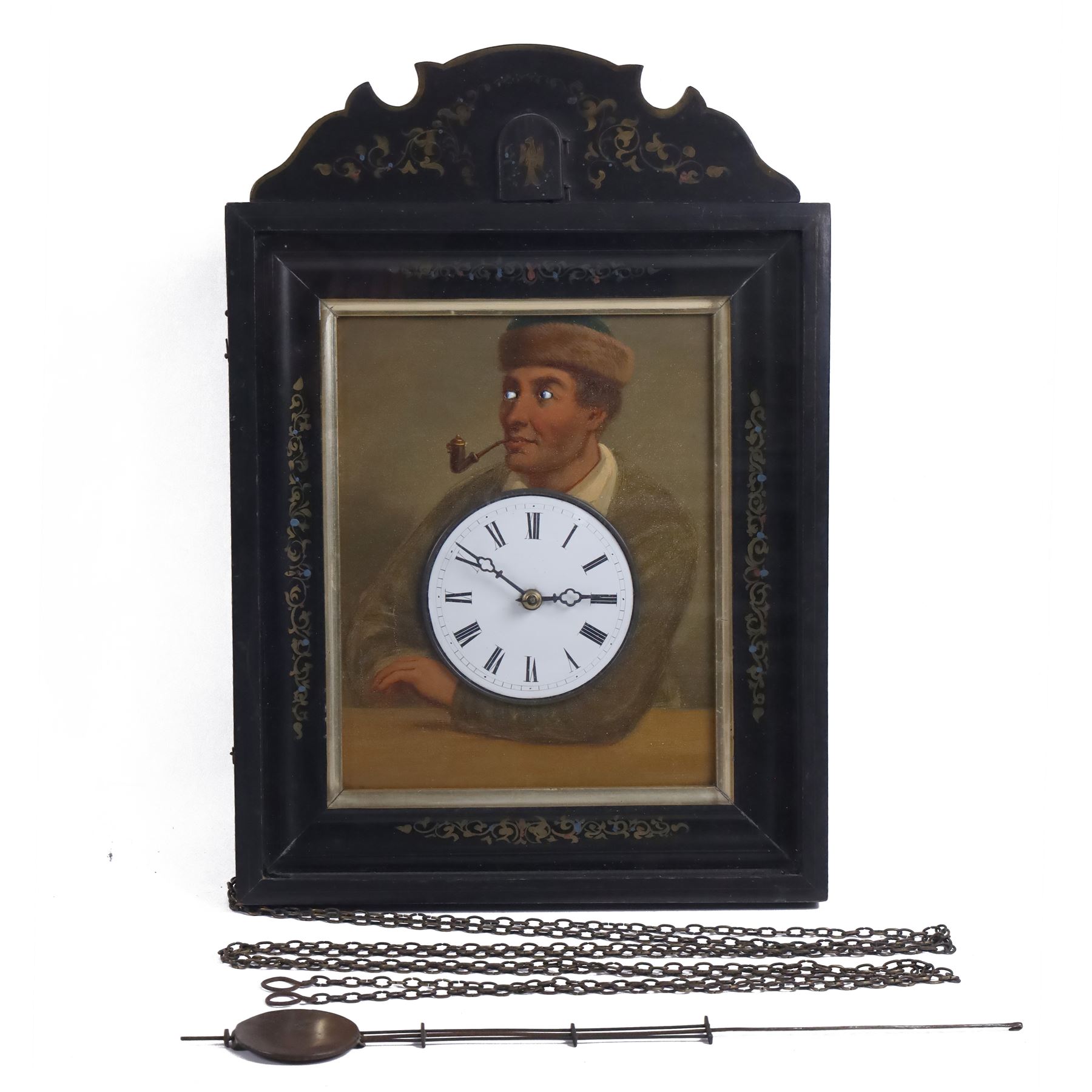 Mid-19th-century Black Forest 'Augenwender' moving eyes Cuckoo wall clock, stained wooden case with painted dial portrait of a man with a pipe and moving eyes, 30-hour brass plate movement striking on a coiled gong, and cuckoo strike together with weights and pendulum 

Literature: Schwarzwald-uhren, Berthold Schaaf (2008) p. 92-94

