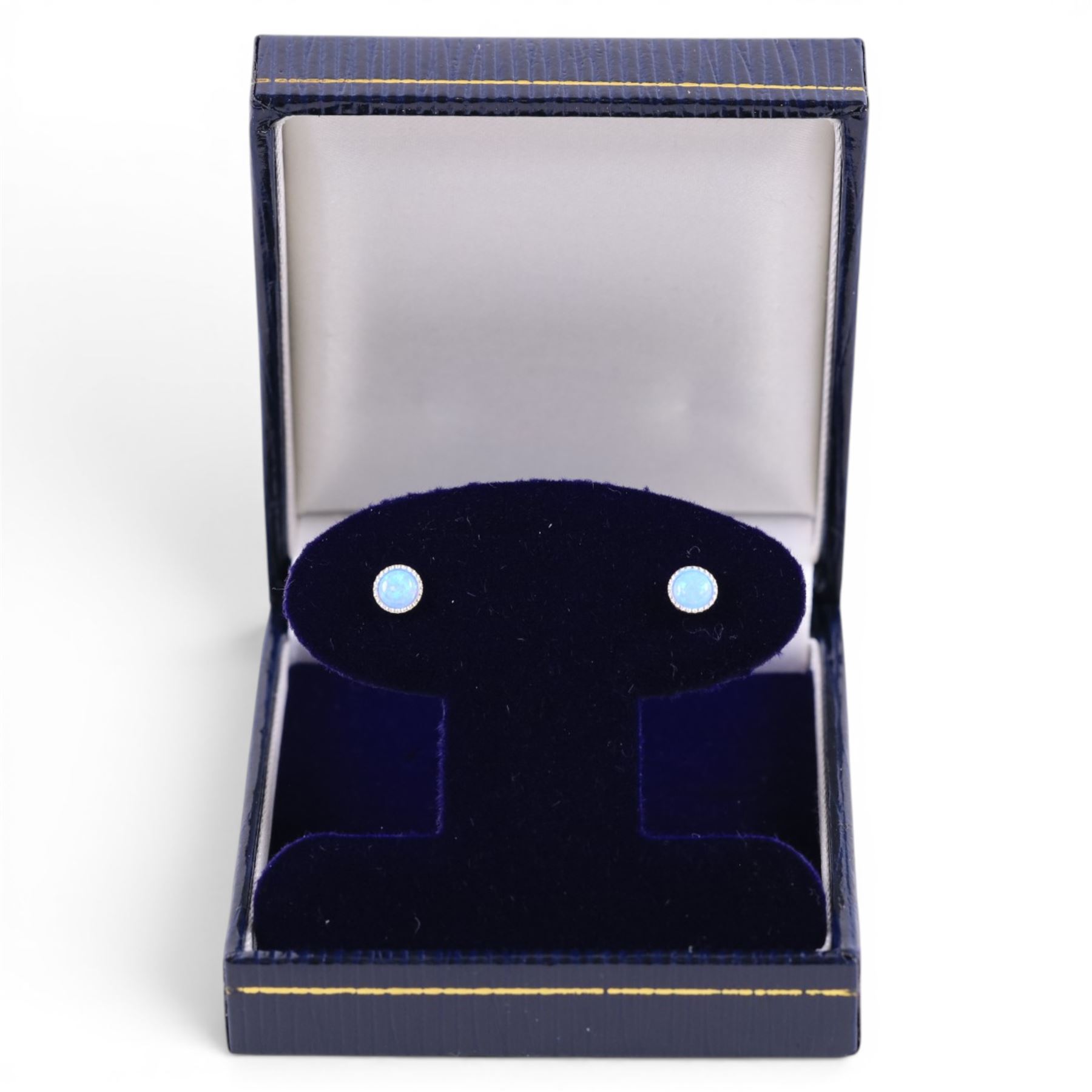 Pair of silver opal stud earrings, boxed