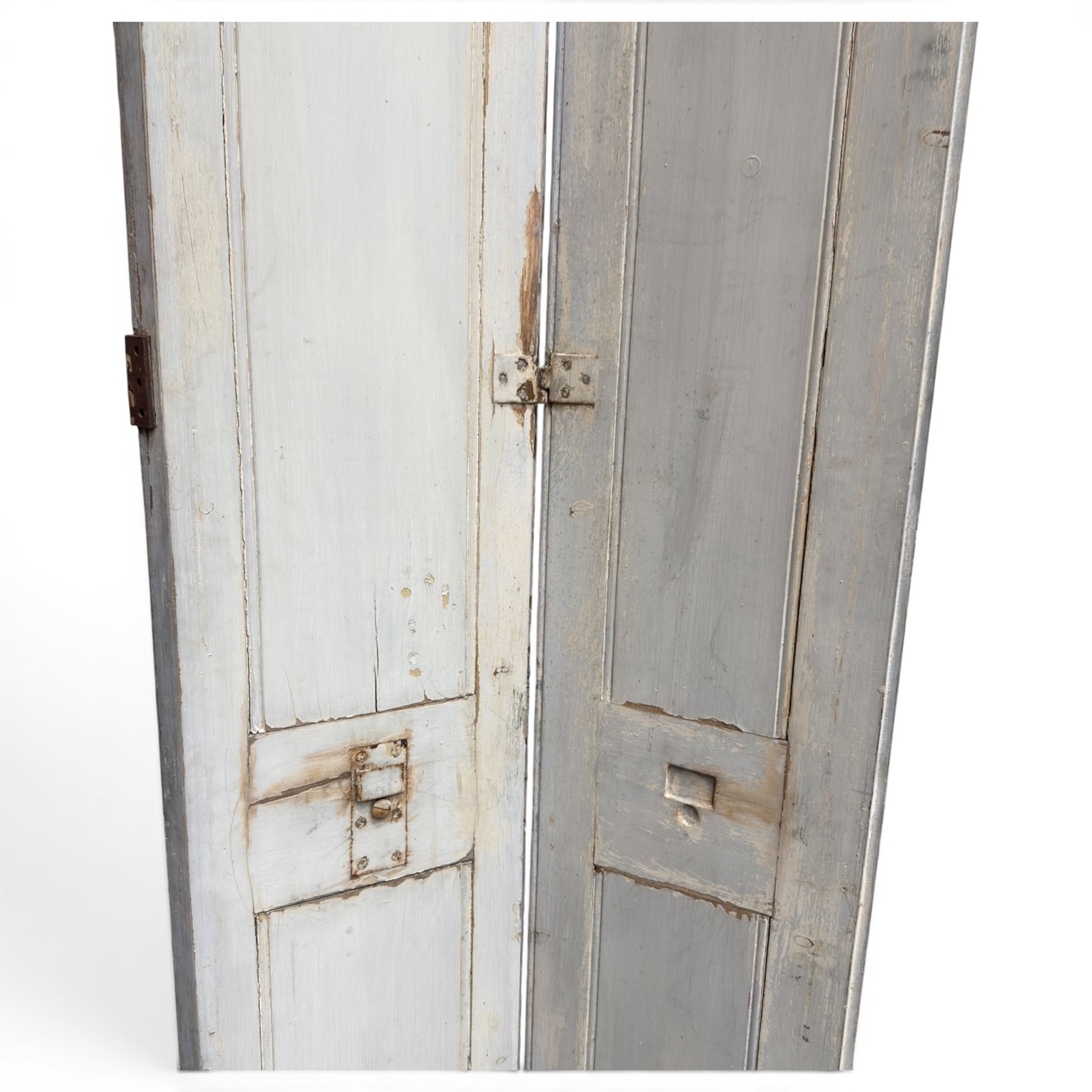 Set of three French 19th century painted pine folding window shutters of tall form, each comprising two hinged leaves with three graduated raised and fielded panels, in antique cream-painted finish