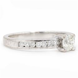 18ct white gold diamond ring, four claw set with a single round brilliant cut diamond of approx 0.40 carat and diamond set shoulders, London 2011