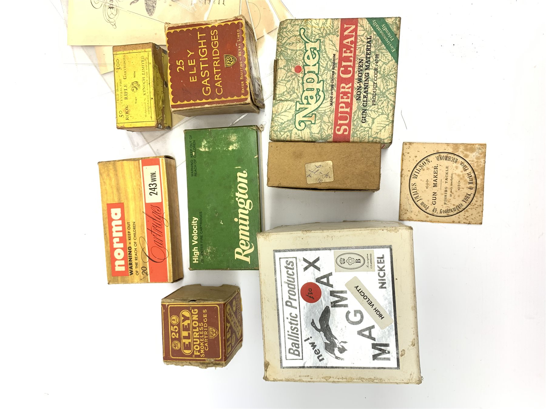 Brass and tin powder magazine by B.E. Chaplin of conical form with glazed see-through nozzle H27cm; eight reprinted gun case labels for Holland & Holland, Thomas Jackson & Son, William Ling, Watson & Hancock, Williams & Powell etc; and quantity of empty cartridge boxes and pellet tins