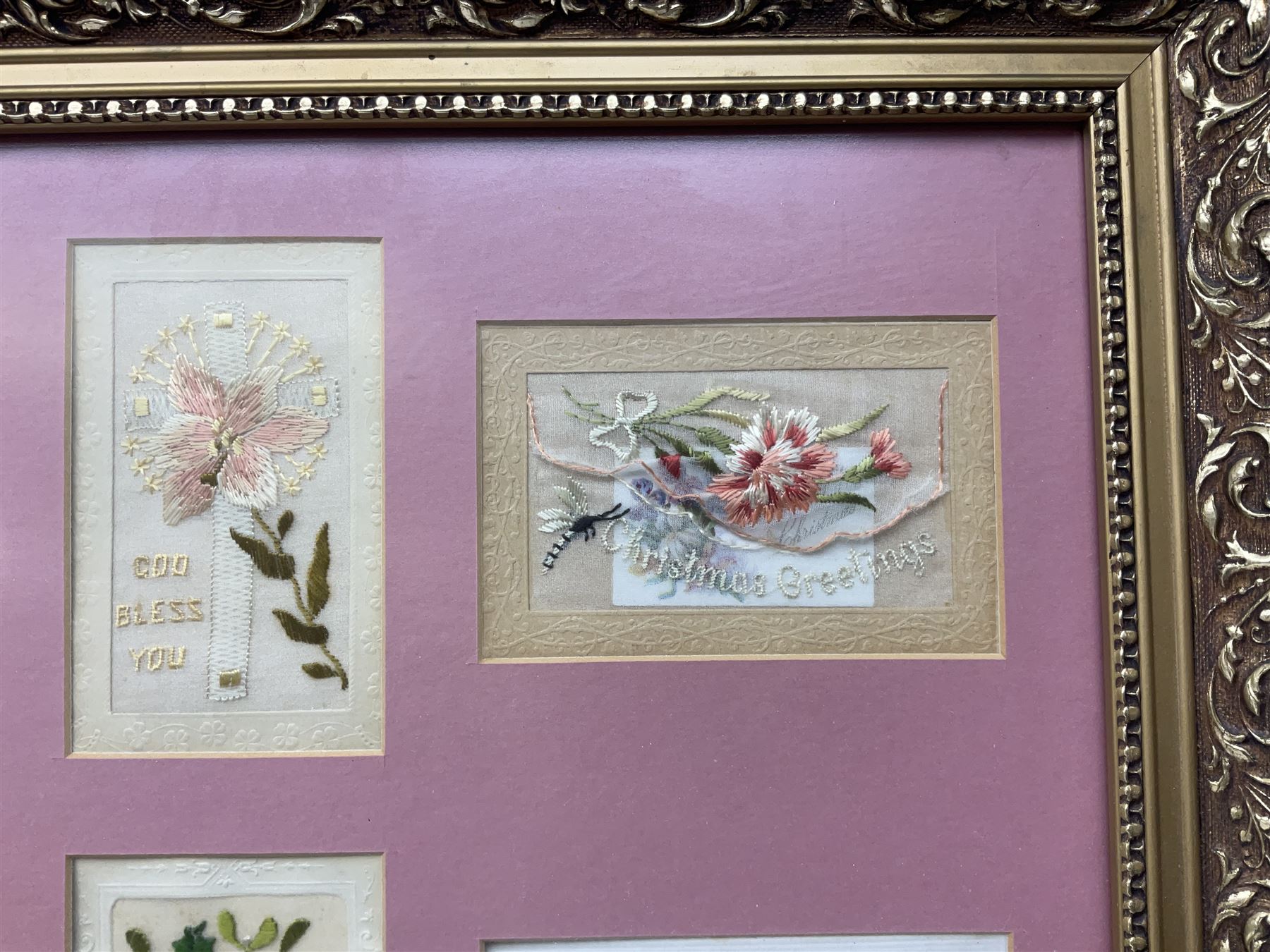 Thirty-five WW1 embroidered silk postcards including regimental crests, flags of the Allies, envelope type with greeting card inserts, Christmas and birthday cards etc; mounted and glazed in three graduated modern matching gilt frames (3)
