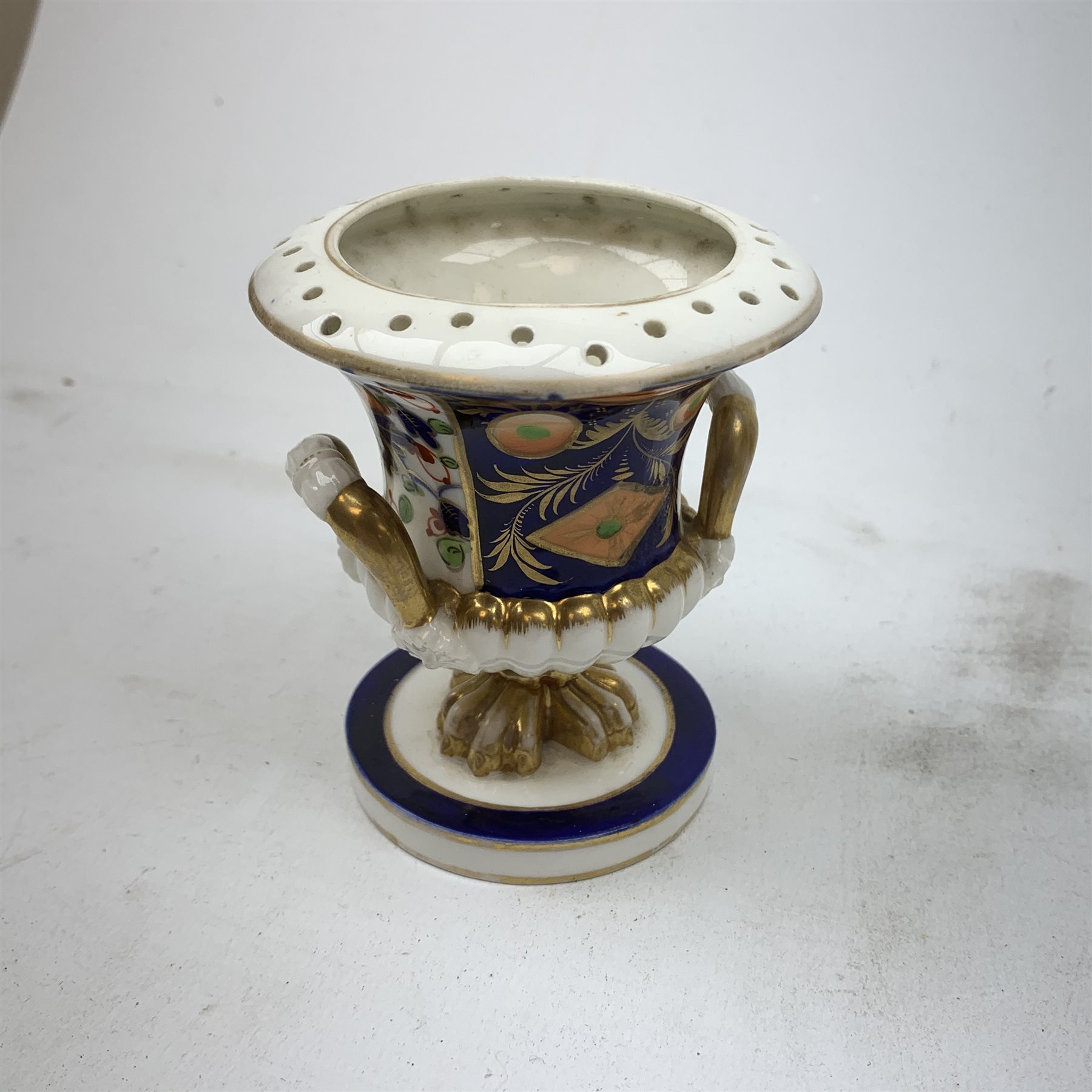 Three Bloor Derby Imari pattern twin handle urms, two examples with covers, each with mark beneath, H12cm, (all a/f), together with a pair of late 19th century Royal Crown Derby Imari pattern urns and covers, each with mark beneath, H13cm, (one significantly a/f). 