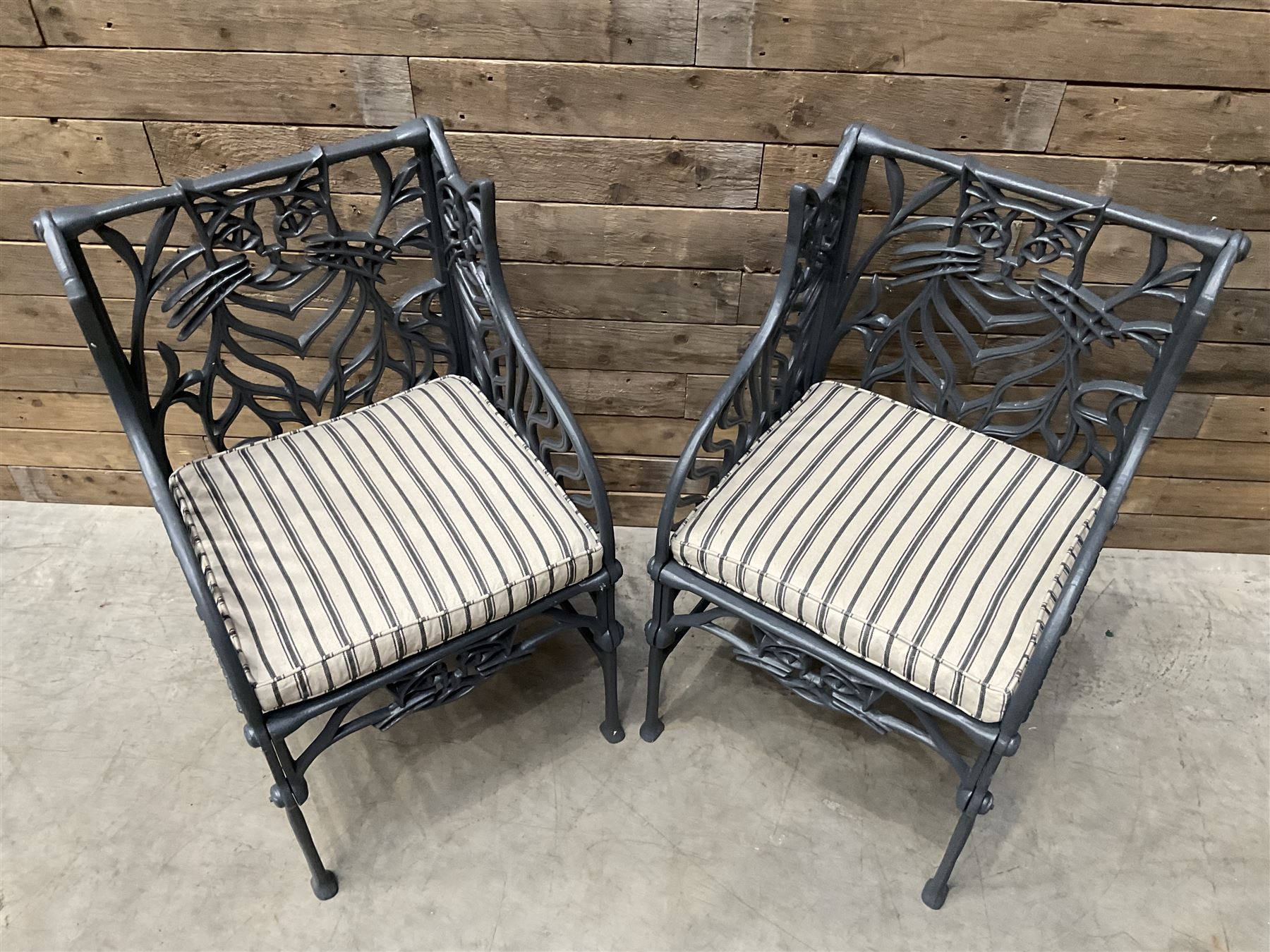 Richard Bawden (1936-2024): Pair of Cat design painted cast iron garden armchairs