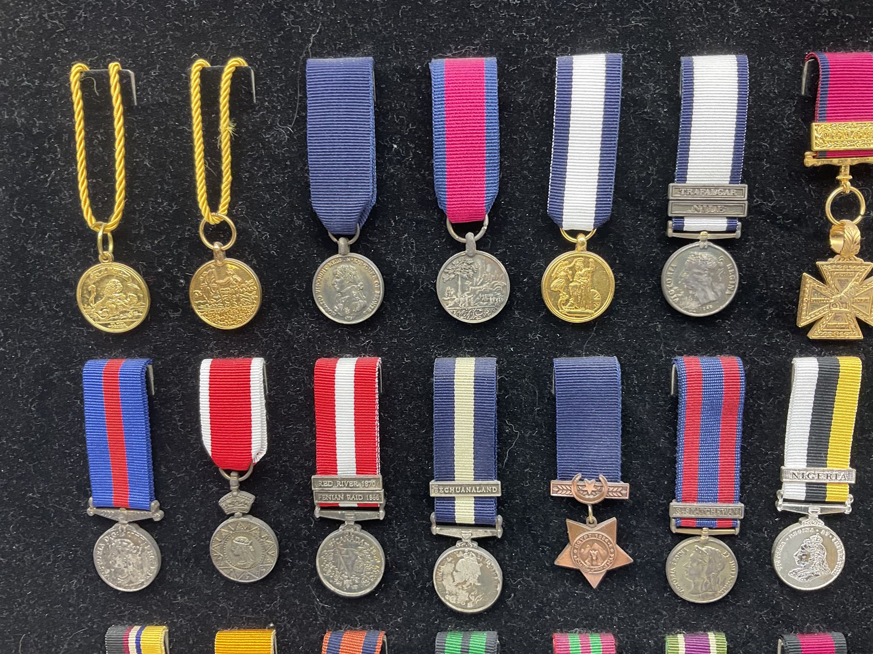 Two limited edition large framed display boards with half-size copies of British Gallantry and Campaign Medals produced by Danbury Mint and entitled 'For Valour'. Sixty medals on each board, all with ribbons. Complete with Danbury Mint certificate serial number A0148 and other paperwork.