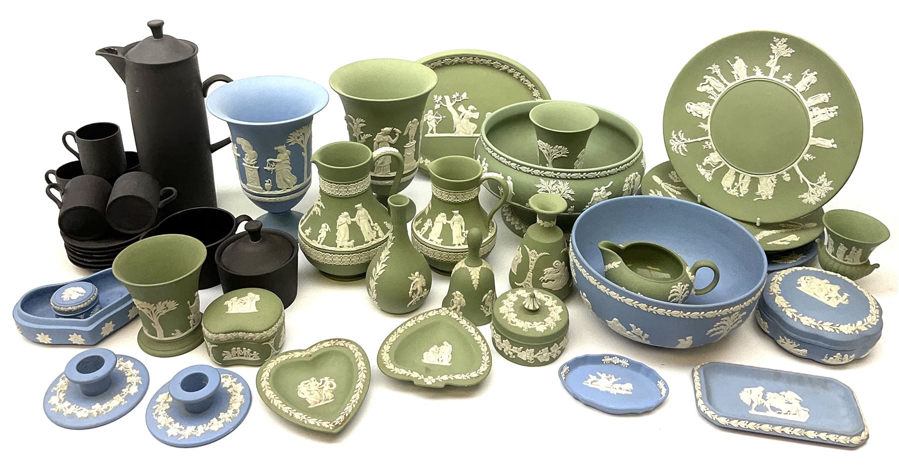 Collection of Wedgewood light blue and sage green Jasperware, to include blue bowl, D20cm, green footed bowl, D20cm, two large vases, trinket boxes, jugs, plates, etc., (29), together with a Wedgewood Black basalt coffee set, comprising coffee pot, milk jug, lidded sugar bowl and six coffee cans and saucers. 
