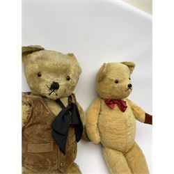 1950s English large wood wool filled teddy bear with swivel jointed head, glass type eyes and vertically stitched nose and mouth and jointed limbs with rexine paw pads H33