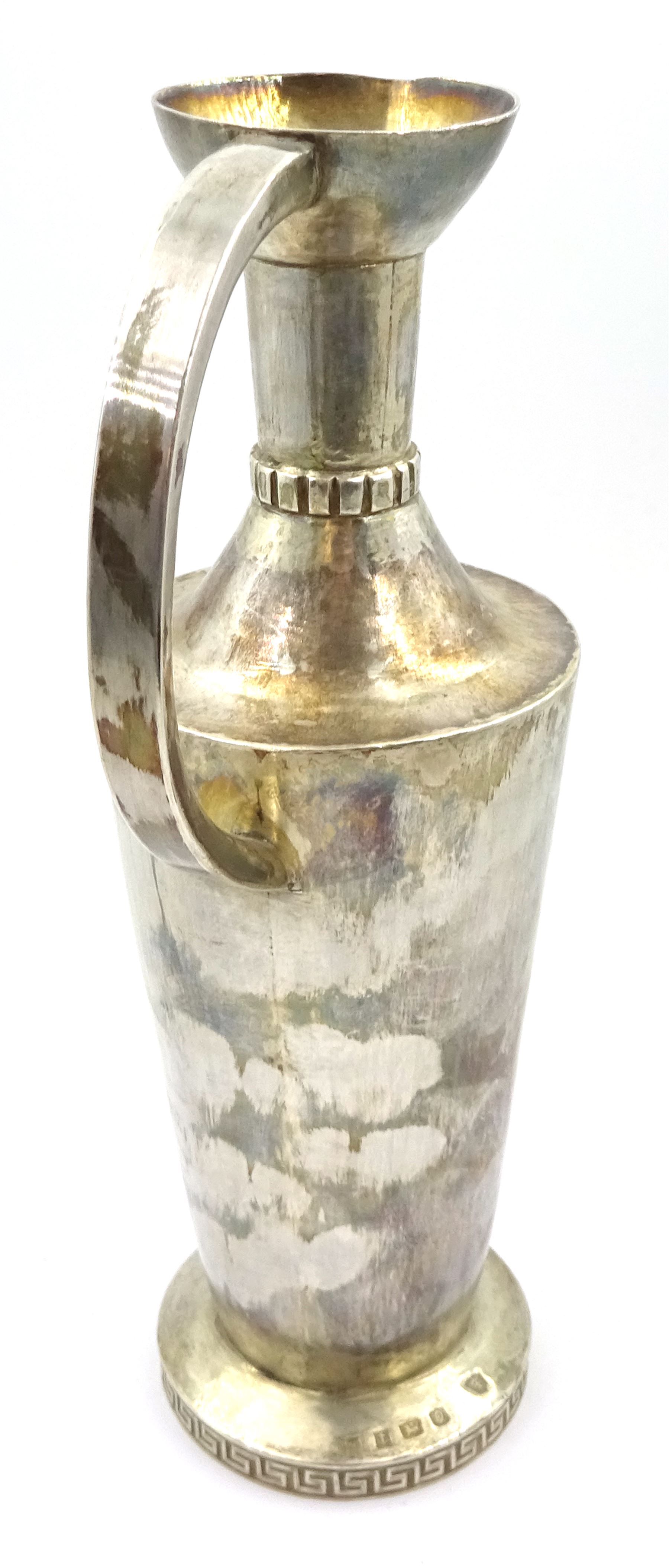 Modern Guild of Hull Silversmiths silver ewer, of tapering cylindrical form with waisted neck and C handle, upon a circular foot with key fret border, hallmarked J & K R, Birmingham 1990, also marked with the three crowns mark of the Guild of Hull Silversmiths, H20cm, approximate weight 7.16 ozt (223 grams)

Abraham Barachin was the last Hull silversmith to use the Hull mark of three ducal coronets in around 1706. 
However in 1983 the Assay Offices of Great Britain and the City of Kingston upon Hull granted the Guild of Hull Silversmiths permission to use the City's Coat of Arms as an additional mark on pieces they produced. 