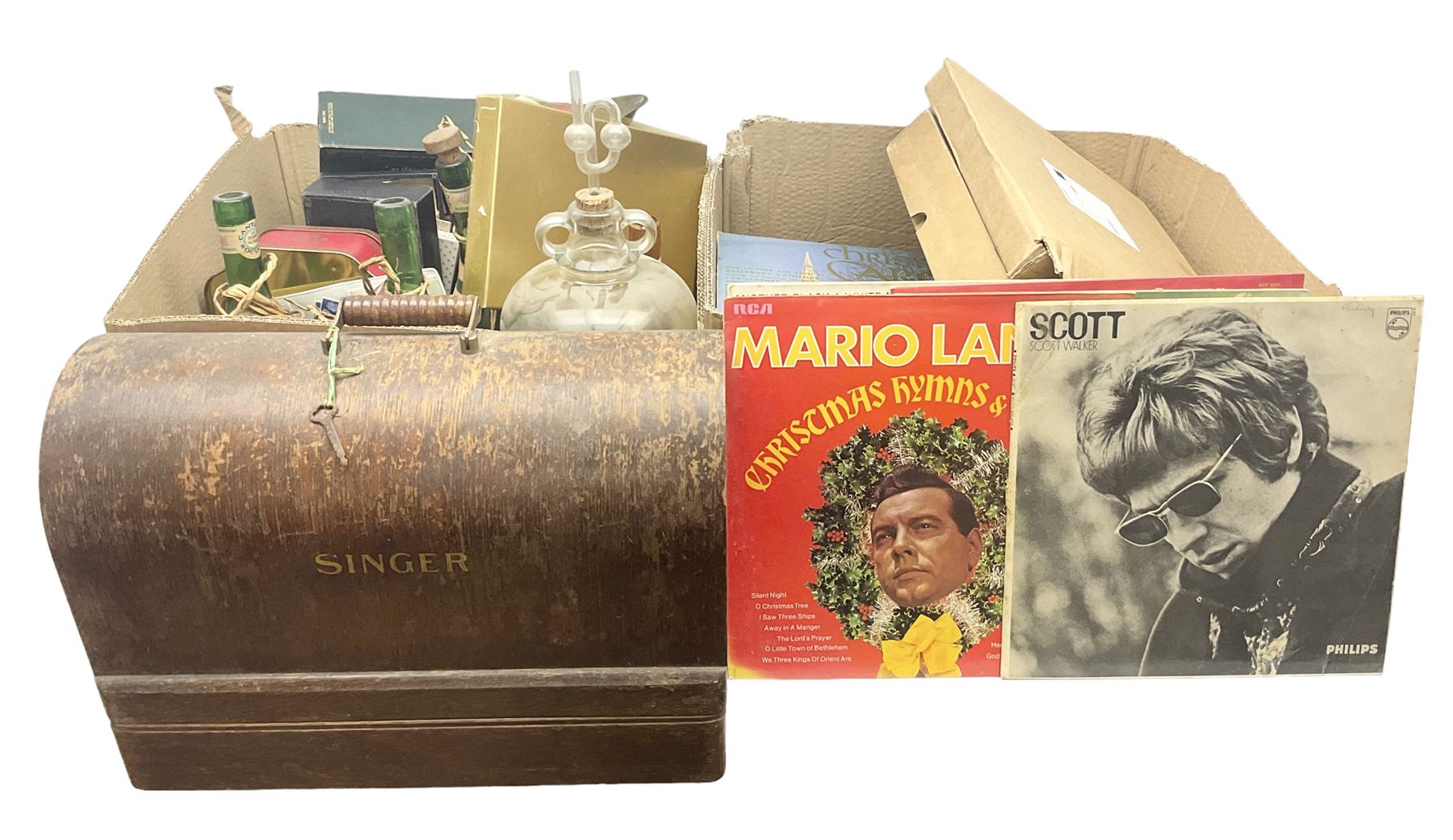 Clear glass demijohn / carboy, four wine bottles with wicker baskets, W T Avery & Co scales, Singer sewing machine, quantity of costume jewellery, trophy stand with silver-plate shields, quantity of vinyl records, stamps etc