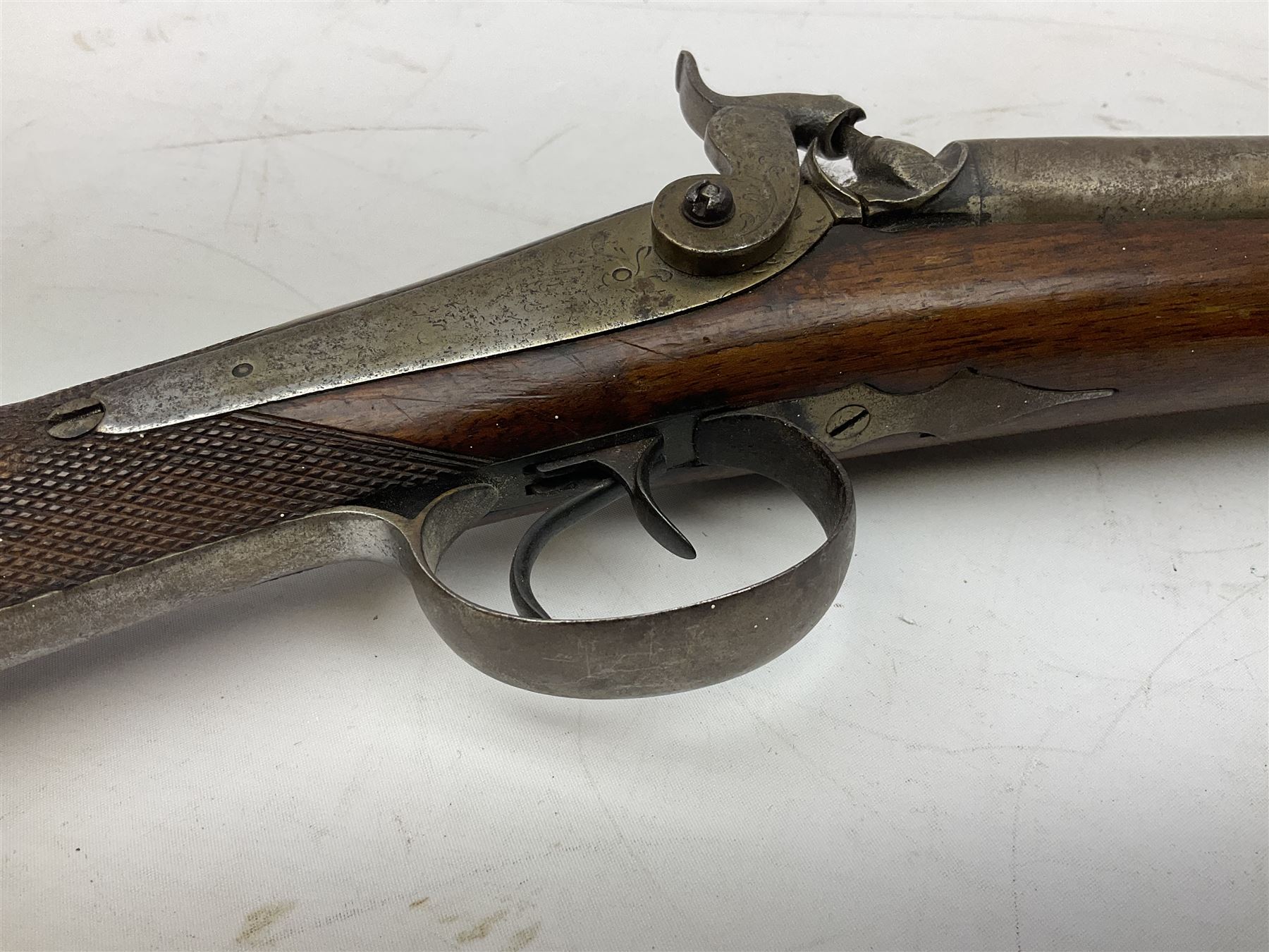 19th century 13-bore double barrel side-by-side percussion cap shotgun, the 72cm stub twist damascus barrels with ramrod under, walnut stock with chequered grip L117.5cm overall