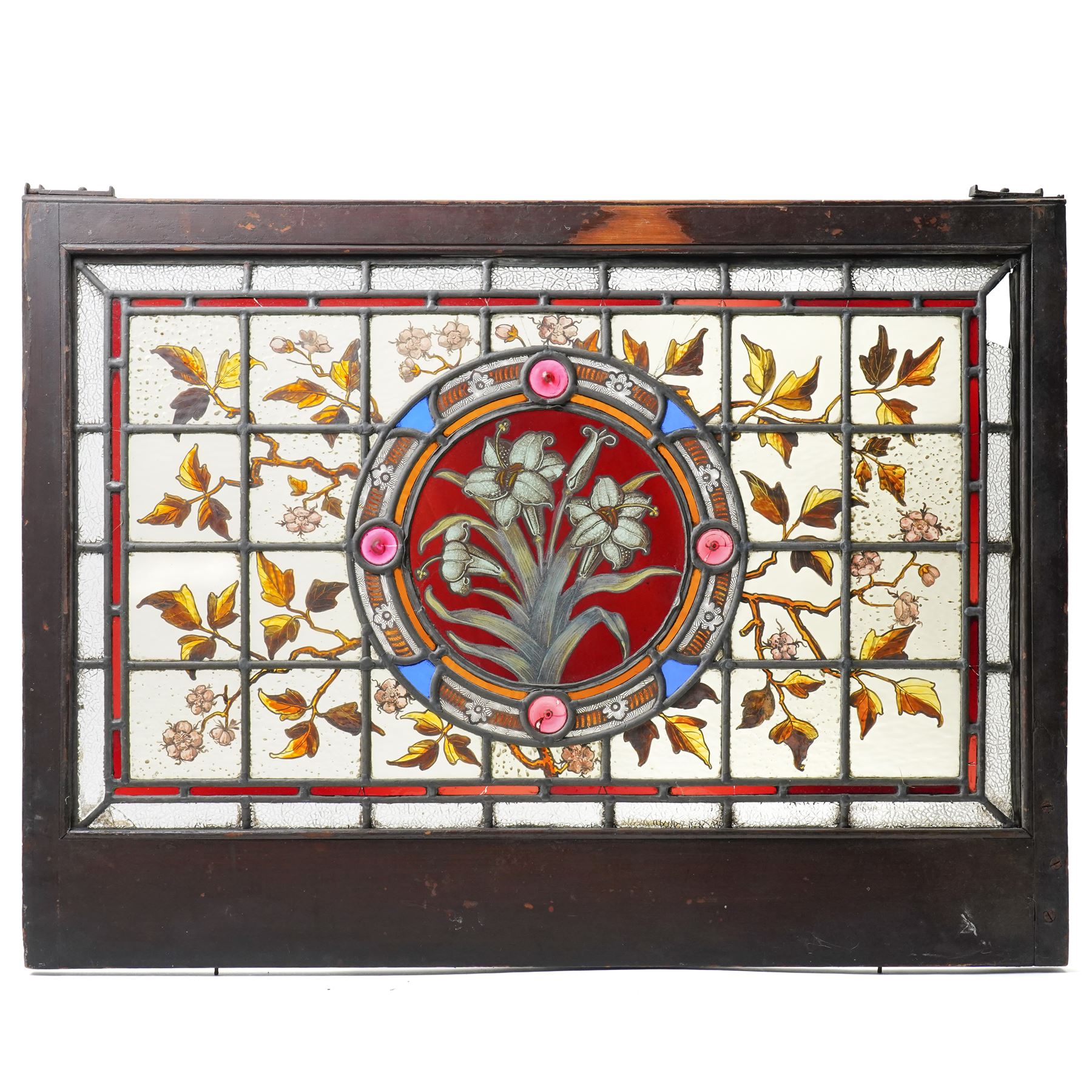 Victorian Aesthetic movement stained glass leadlight window panel, the central panel hand painted with a sprig of daffodils, the surrounding panels profusely decorated with branches and leaves, overall 62cm x 84cm 