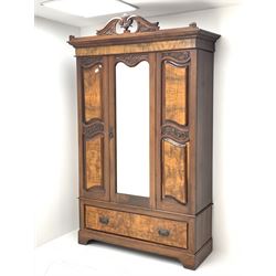 *Late Victorian walnut wardrobe, scrolled pediment with central carving, enclosed by single bevelled mirror glazed door, the front set with shaped figured panels and carved with scrolled foliage, single drawer to base, W134cm, D51cm, H220cm, 