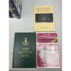 Eleven medal reference books including Ian Bisset: The George Cross; Spinks British Battles & Medals; William Spencer: Medals - The Researchers Guide; John D. Clarke: Gallantry Medals & Decorations of the World; Officers of The Green Howards 1931-1972; and six others (11)