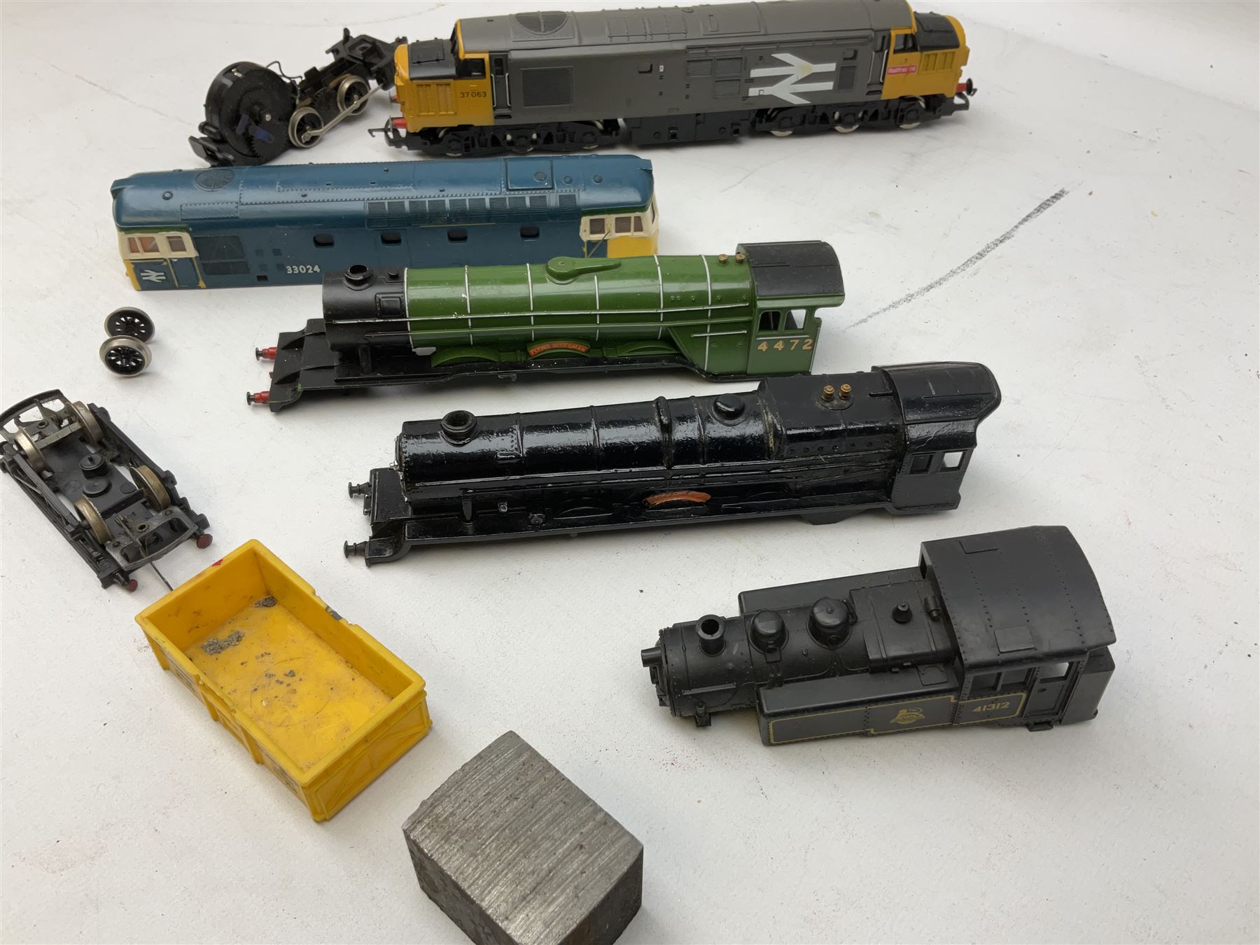 '00' gauge - Tri-ang 'Caledonian Single' Class 4-2-2 locomotive and tender; Hornby Class 37 Diesel (English Electric Type 3) locomotive No.37063; Airfix Class 61XX 2-6-2 Prairie tank locomotive No.6167; Pocher Italy American style 4-4-0 locomotive 'Reno'; and a quantity of part locomotives, spare parts etc; all unboxed