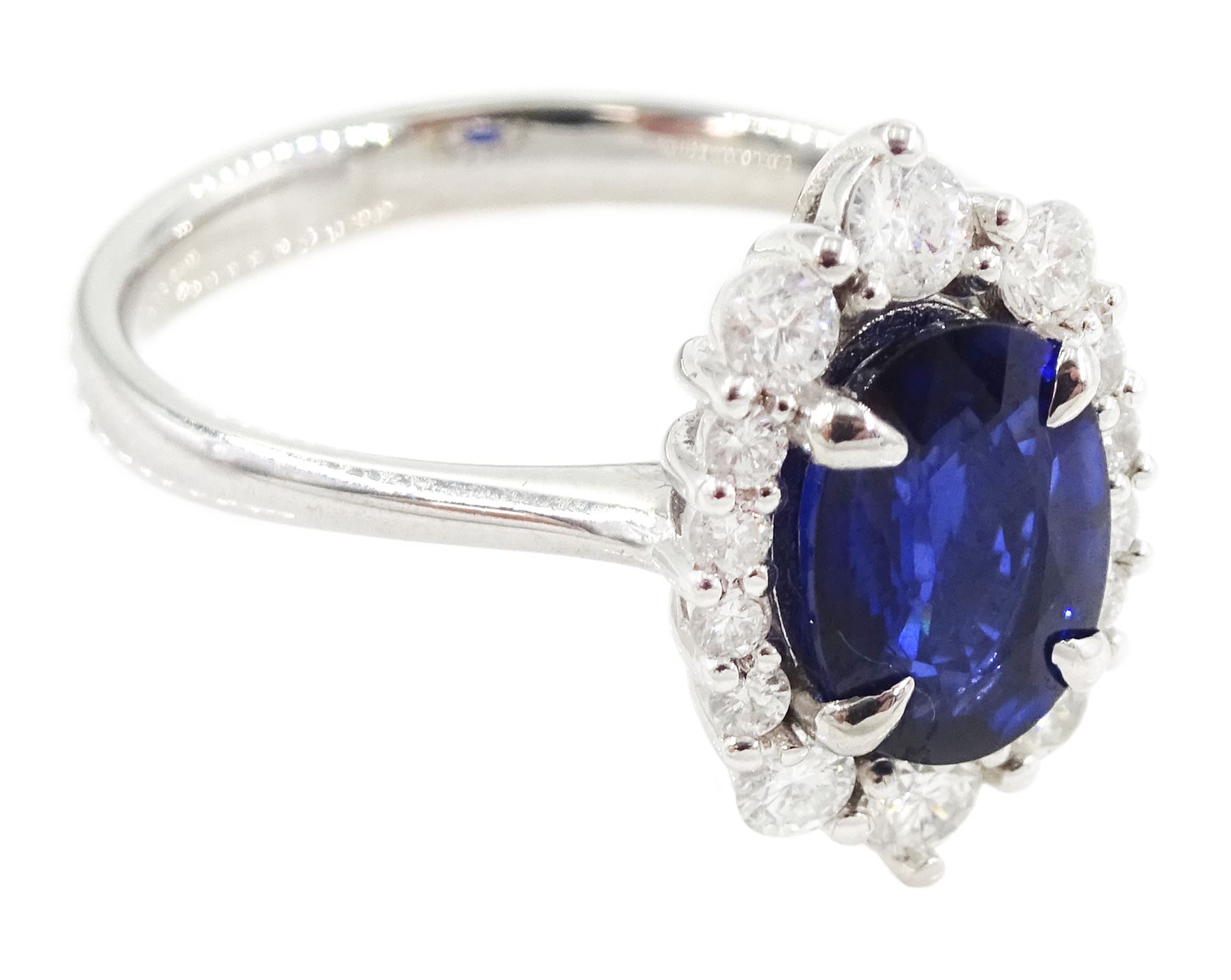 14ct white gold sapphire and diamond cluster ring, single oval cut sapphire of approx 1.00 carat, with round brilliant cut diamond surround, total diamond weight approx 0.40 carat