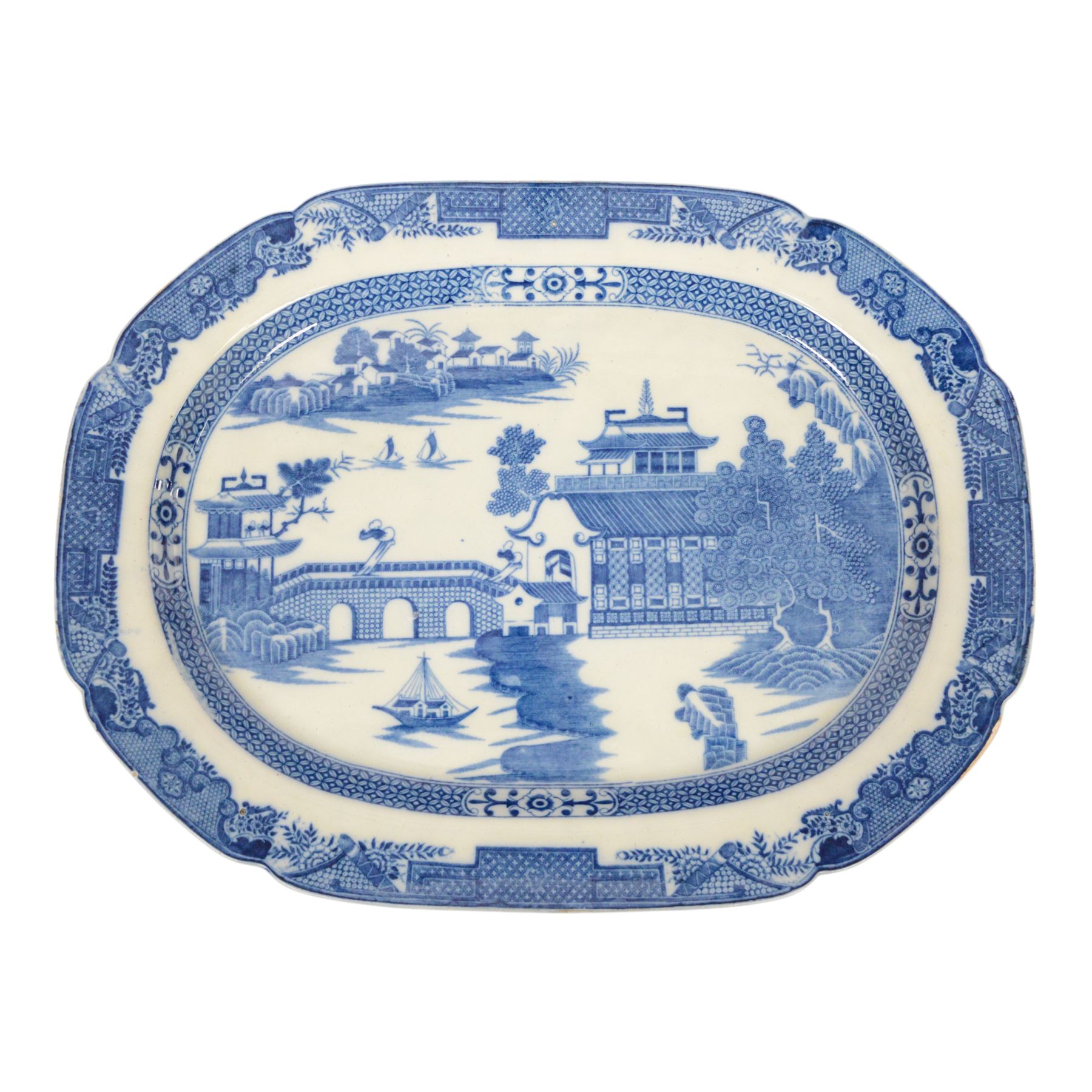 Pair of large 19th century blue and white platters, decorated in the Long Bridge pattern with pagodas, boats and figures, within a decorative border with scrolls, D39.5cm W52cm