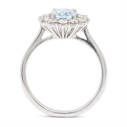 18ct white gold aquamarine and diamond cluster ring, single oval cut aquamarine of approx 0.85 carat, surrounded by twelve round brilliant cut diamonds, hallmarked, total diamond weight approx 0.50 carat