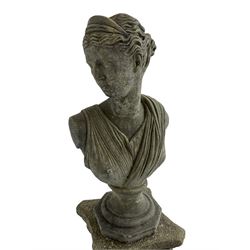 Classical design cast stone female bust depicting Artemis, raised on fluted Corinthian column with acanthus leaf capital, stepped square base, looking right 