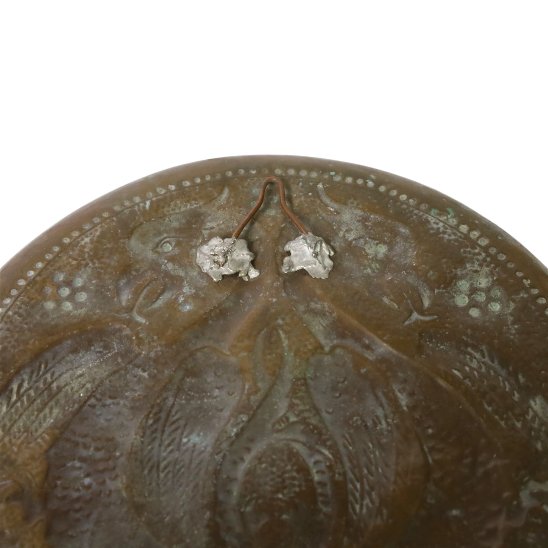 W H Mawson for Keswick School of Industrial Arts copper dish, embossed with two dragons and a serpent, signed W H Mawson Keswick, D24cm