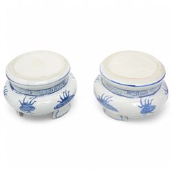 Pair of Chinese blue and white vases and stands, of baluster form with elongated neck, decorated with painted scenes of dragons amongst clouds, the twin handles formed as two crouching dragons, including stands H32cm