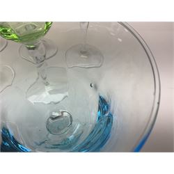 Ten coloured Adriana wine glasses by Abigails, to include blue, green, pink and yellow examples, each with part faceted bowl and twist stems, together with two similar orange examples with pulled stems, H24cm