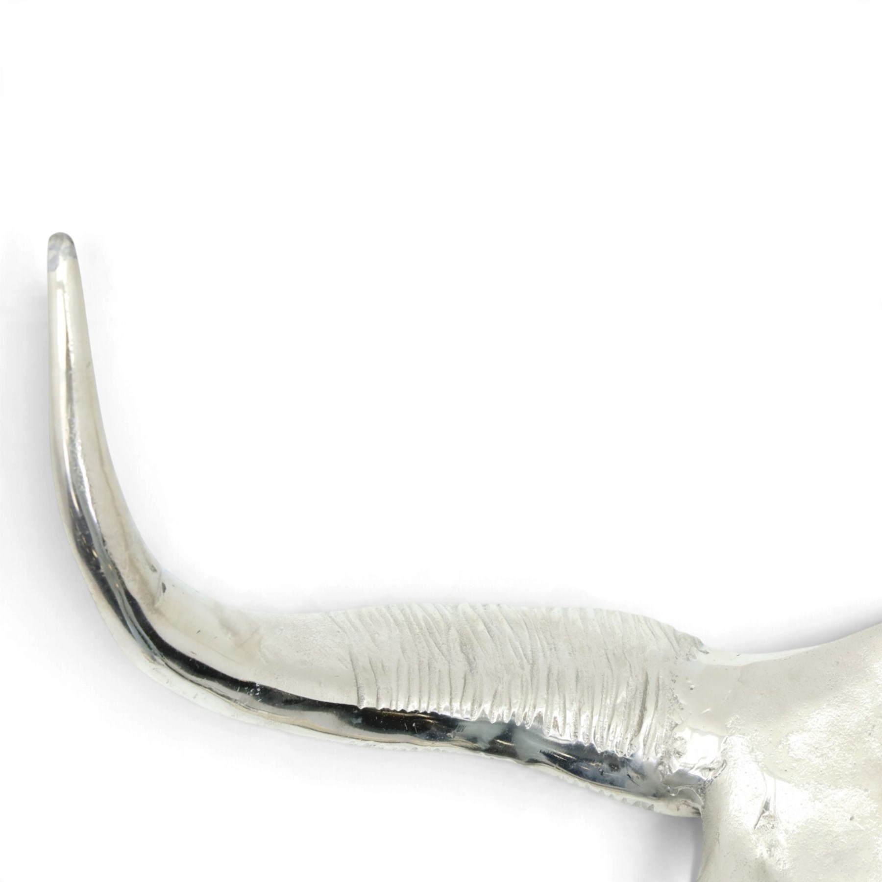 Contemporary cast metal bull skull wall ornament, polished silver finish with textured detailing and outstretched curved horns  