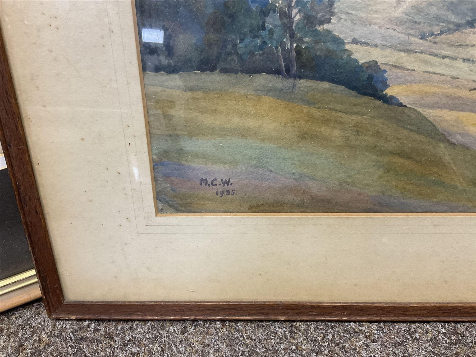 G A Townsend (British 20th century) 'The Trout Inn', watercolor signed and dated; M C W (British 20th century) The Wolds watercolor signed and dates, together with another watercolour and three landscape prints