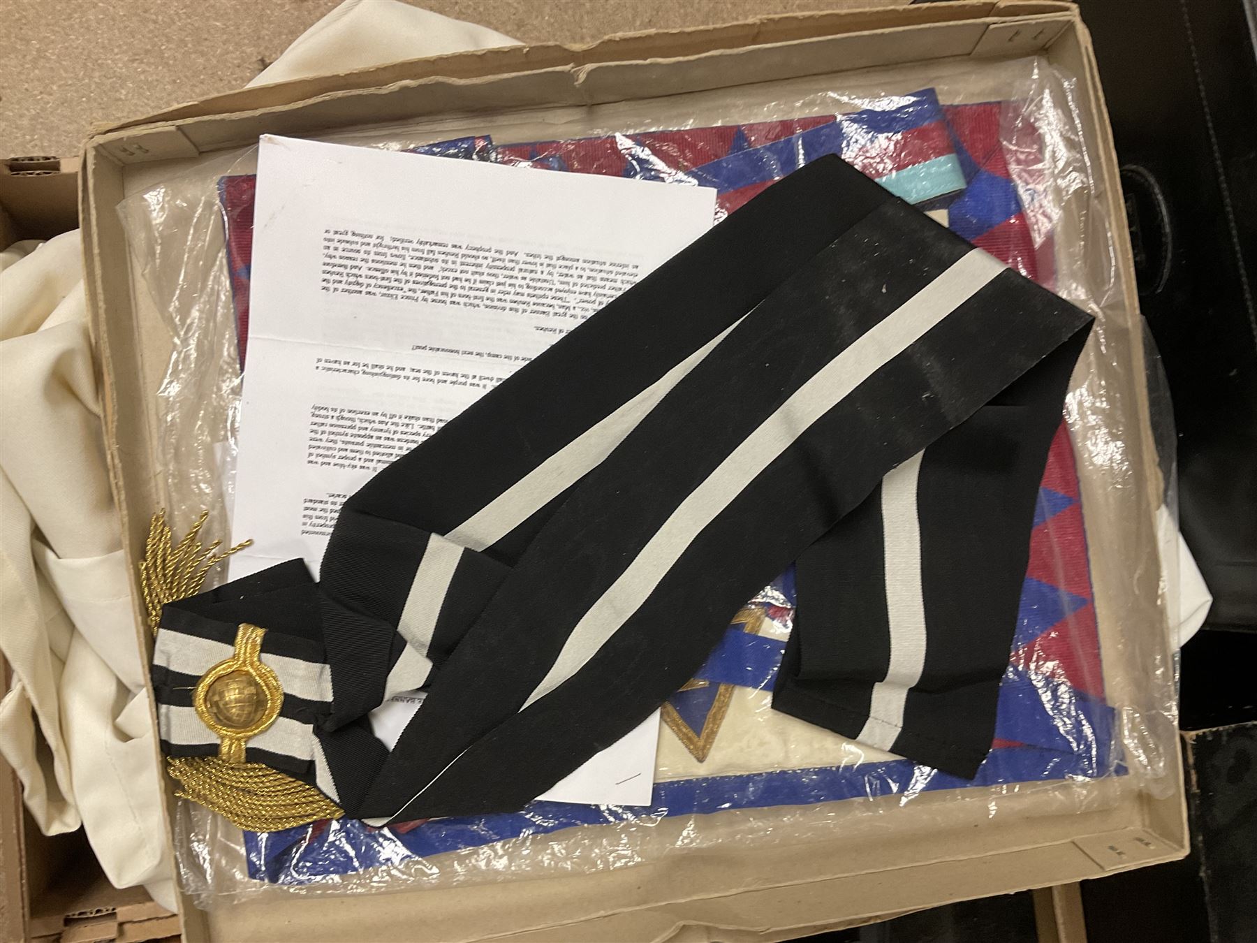 Masonic regalia, including sword, kid leather gloves and apron, Order of Holy Wisdom high priest mitre, etc, contained within briefcases and boxes 