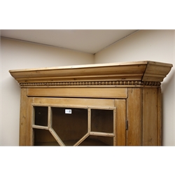  19th century pine corner cabinet, projecting cornice, astragal glazed door enclosing shelves above single panelled doors, shaped plinth base, W102cm, H199cm, D52cm (MAO0403)  