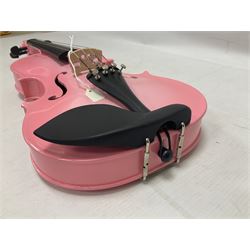 Zest full size pink violin, with a solid wood body and maple head, with matching pink bow and two further bows, in a hard case Length 60cm
