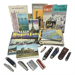 Seven pen knives, two lighters, including one Ronson example and a collection of postcards