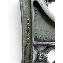 Neoclassical design cast iron and oak slatted garden bench, the twin end supports in the form of a Sphinx with acanthus carved knees and large paw feet, the pierced lattice bracket with Yorkshire rose motifs