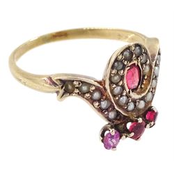 Victorian 9ct rose gold red paste and seed pearl ring, oval paste stone within a scrolling border of seed pearls, surmounted with round cut red paste stones