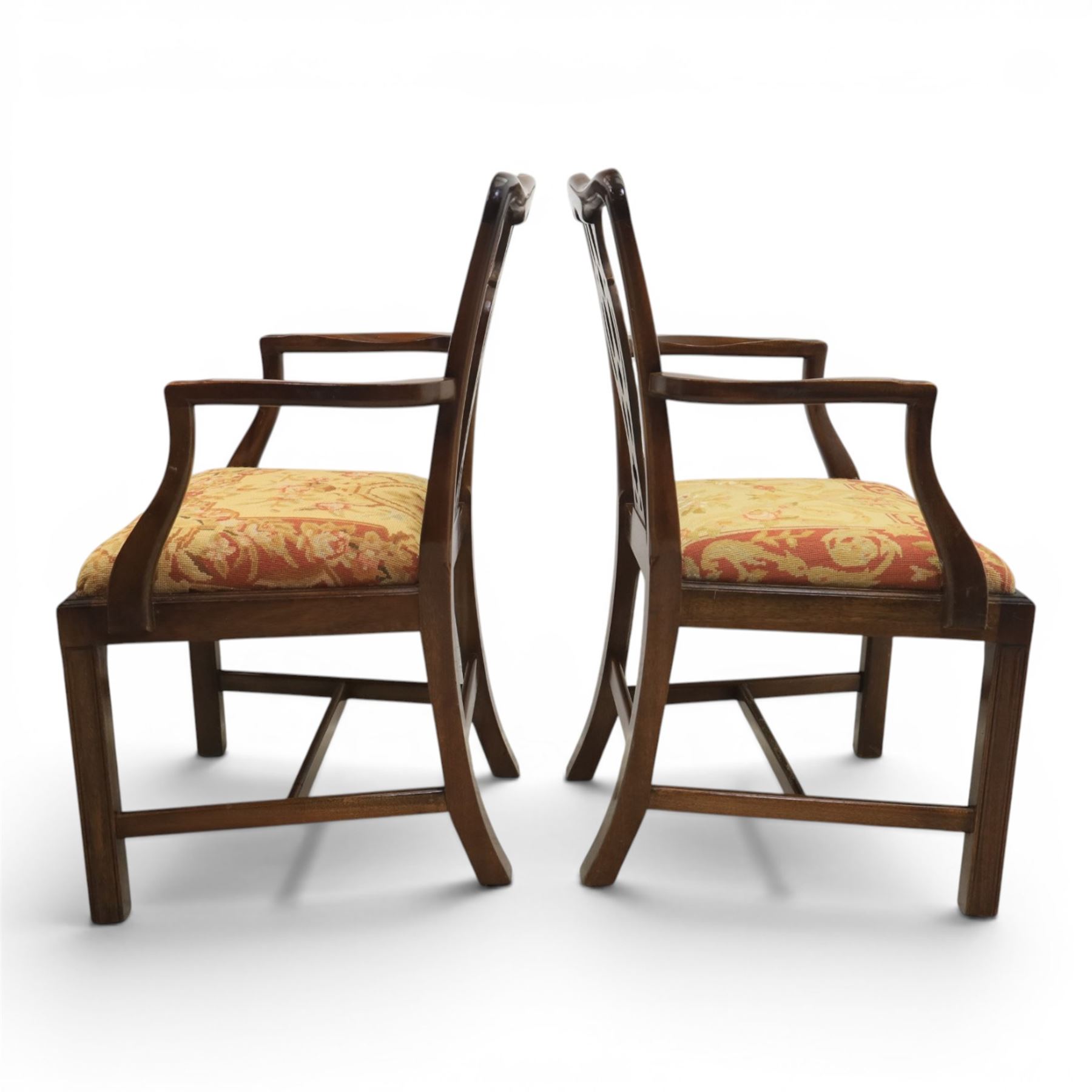 Large 19th century mahogany extending dining table with set of Chippendale design chairs, extending dining table with rectangular moulded top additional three leaves, raised on turned supports terminating in brass castors, the dining chairs (2 + 2) with shaped cresting rail and pierced splats, raised on square supports with stretchers