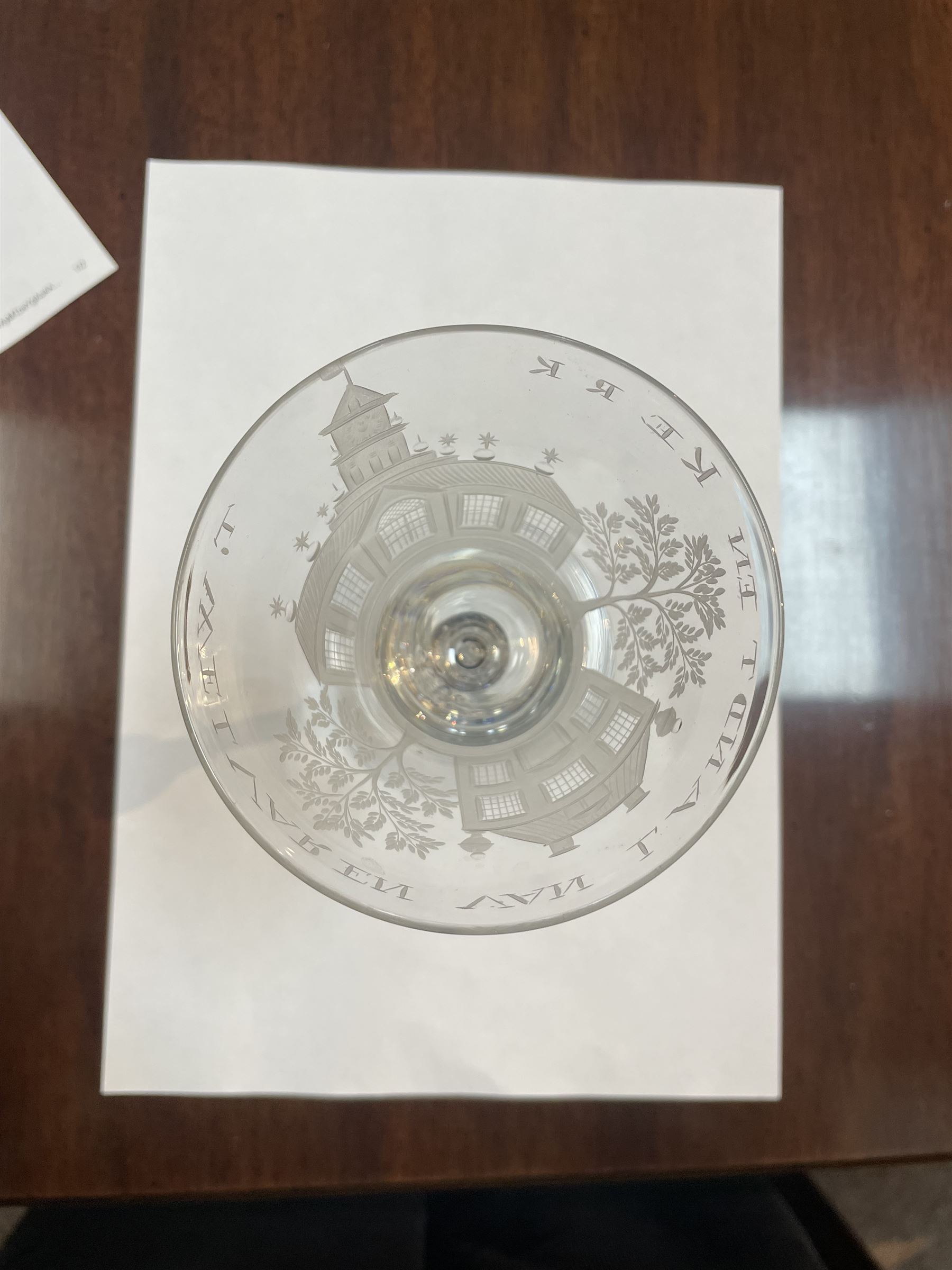 Dutch engraved Newcastle light baluster glass, circa 1760, the funnel bowl engraved with a two storey country house and church flanked by trees, beneath the inscription ‘T WELVAREN VAN LANDT ENKERK’ (The prosperity of the Country and Church), upon a multi knopped stem with beaded knop and basal knop, over conical foot, H18cm



